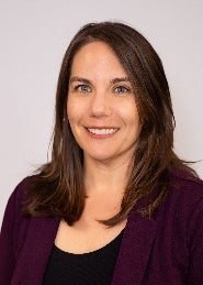 Woman with brown hair smiling